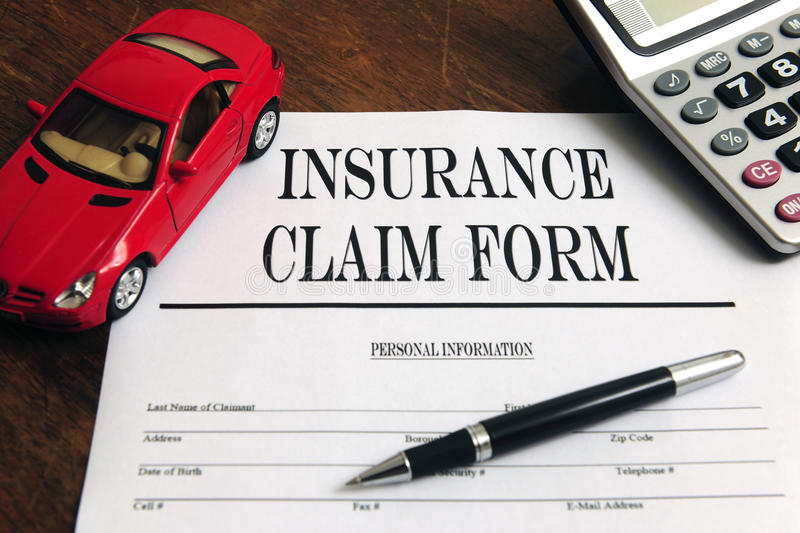 car-insurance-claim-form-desk-13783213